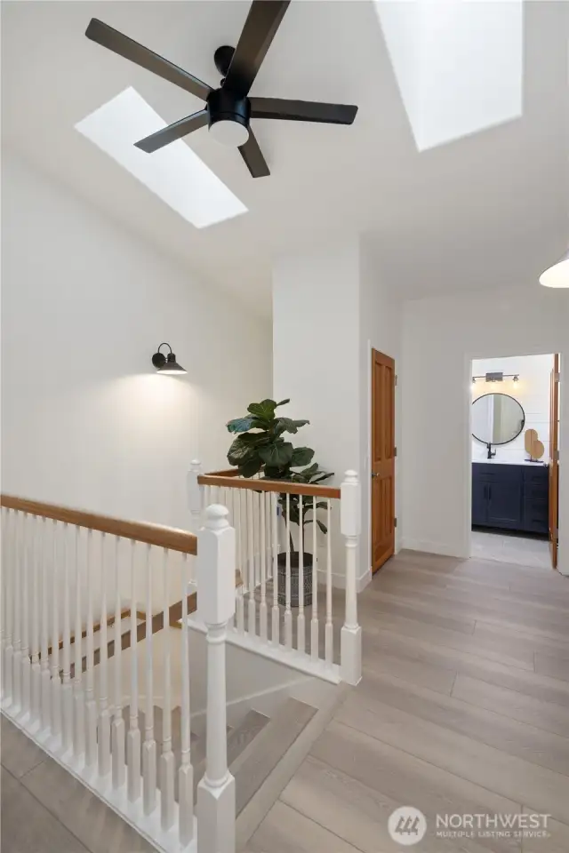 Skylights fill the second floor landing with natural light.