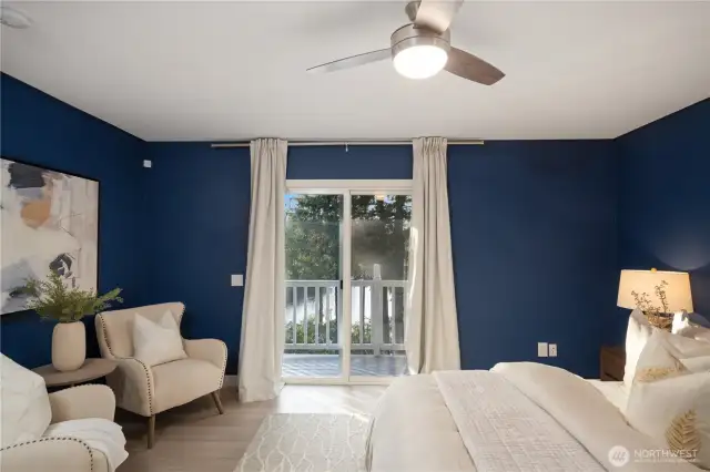Primary suite with 5-piece ensuite bath and generous walk-in closet overlooks the glistening lake to the west.