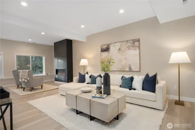 Lower level media space with soaring 10 foot ceilings and views of the lake below