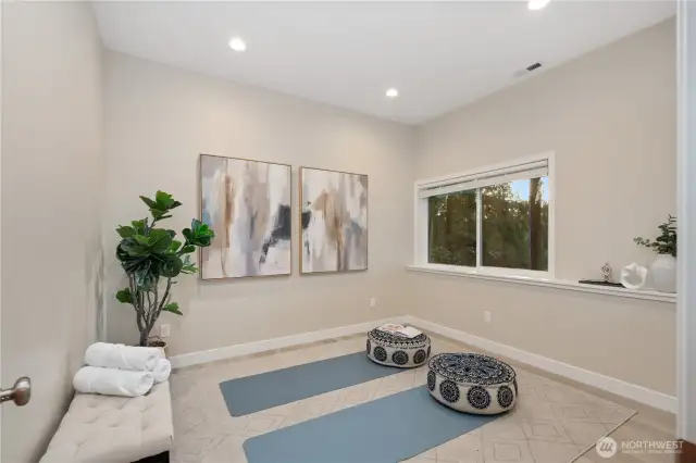 Lower level office or exercise room with soaring 10 foot ceilings and views of the lake below