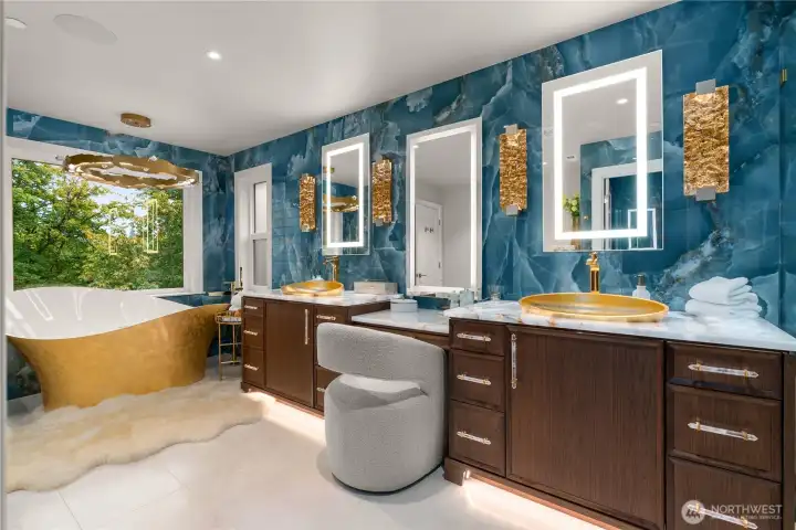 Back lit white onyx countertops, heated floors and crystal hardware