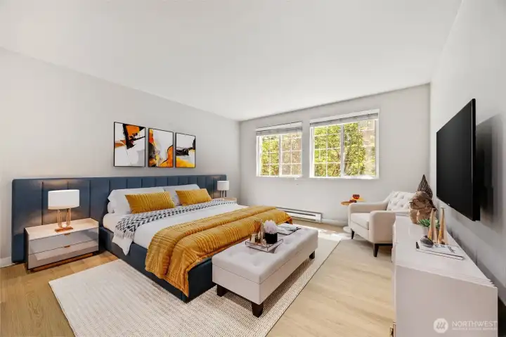 Primary bedroom with new flooring underfoot and fresh interior paint. Lots of room for even a King Sized bed.