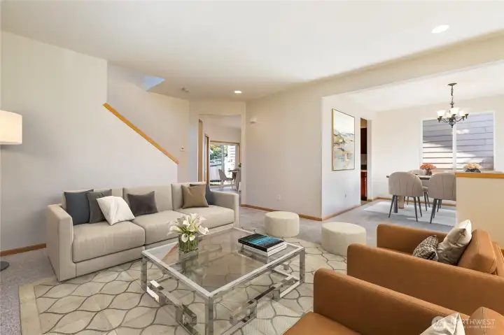 Virtually staged living room looking towards formal dining to right