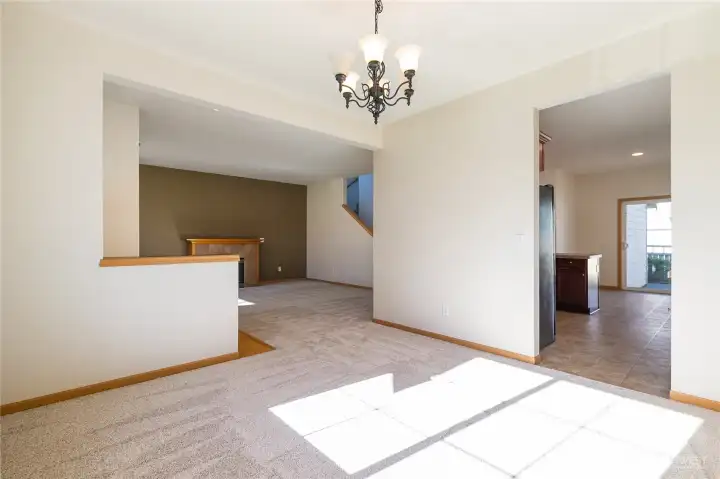Formal dining looking back to living area on left & kitchen on right
