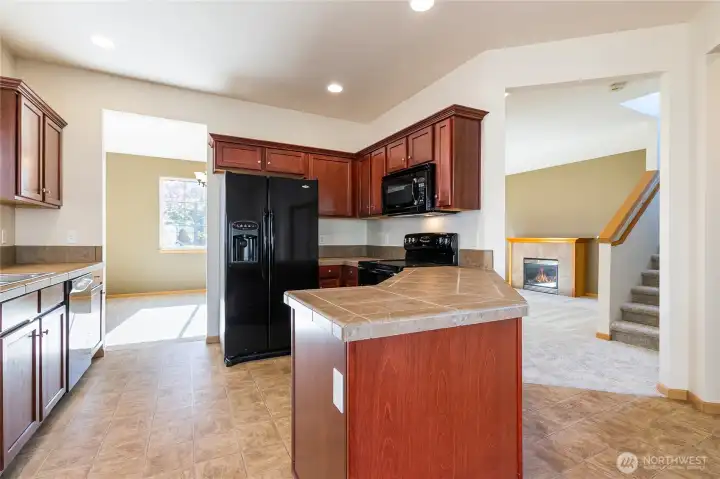 Kitchen looking back to formal dining on left & living area on right
