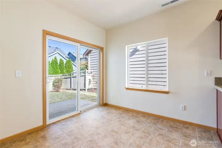 Dining area with slider to fully fenced back yard