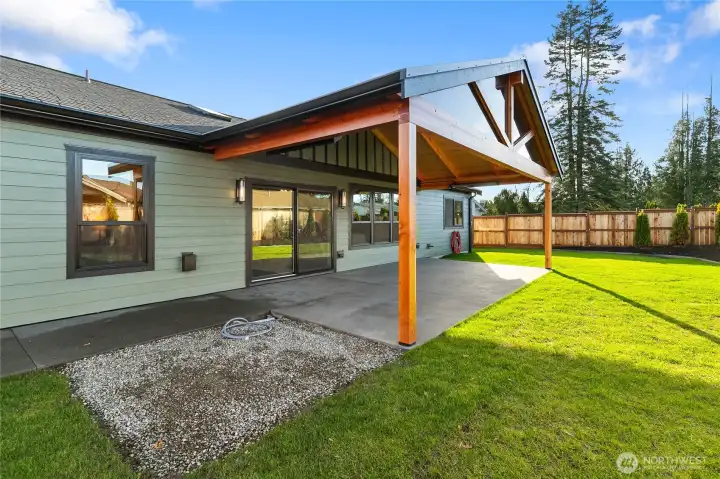 Private, fully fenced backyard with oversized heated patio and hot tub ready