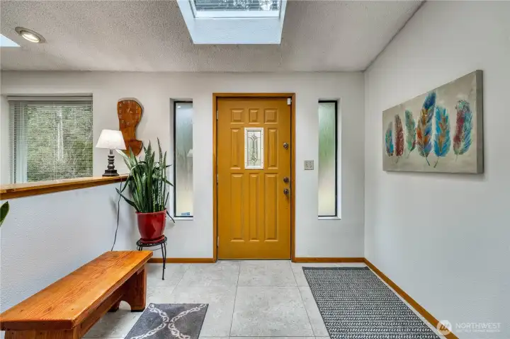Welcoming entry way is a spacious place to get in from the weather.