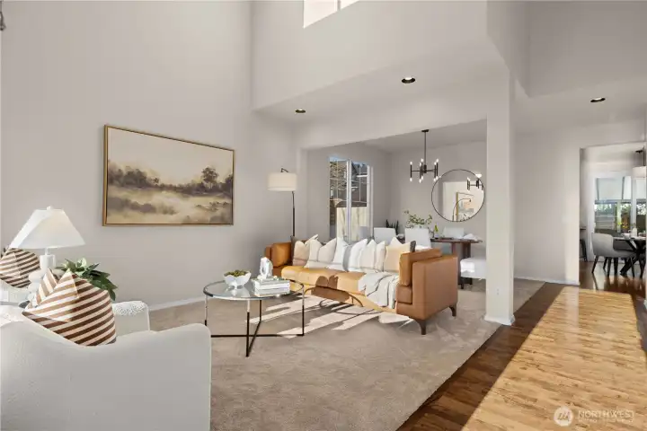 Spacious 2-story living room with skylights and tall windows brings in tons of natural light