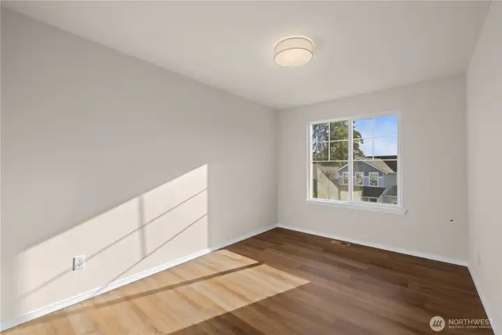 Upper level bedroom 5 of 5 has LVP flooring. Perfect for crafting, yoga, gym or bedroom!