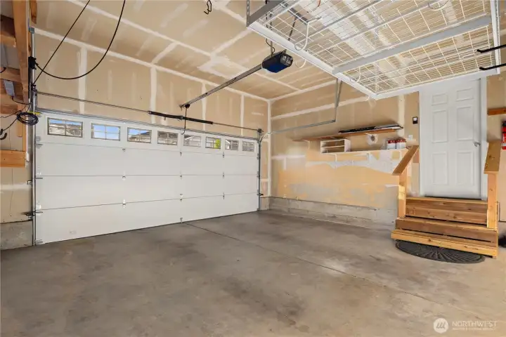 The large 2-car garage is extra high allowing for overhead storage.