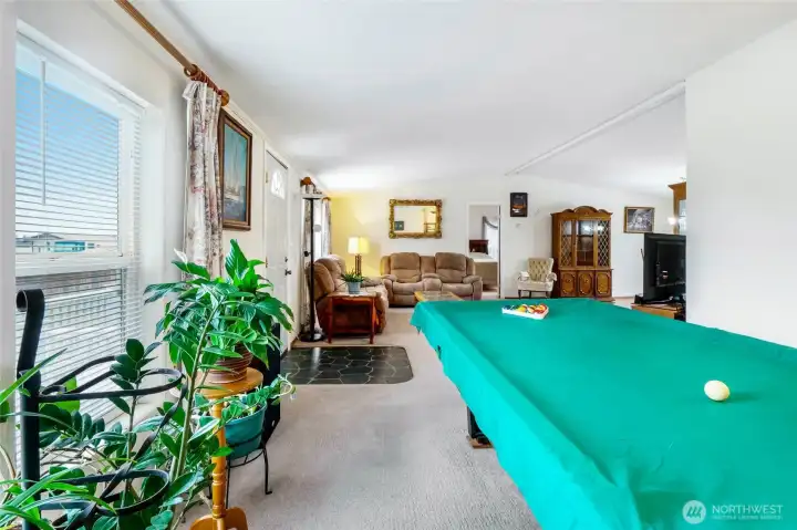 Lots of room in the family room for a second gathering space or playing pool!