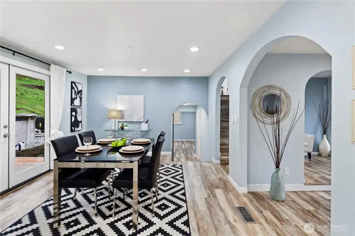 A few steps down from the dining room is the pantry, 1/4 bath with laundry & bonus area