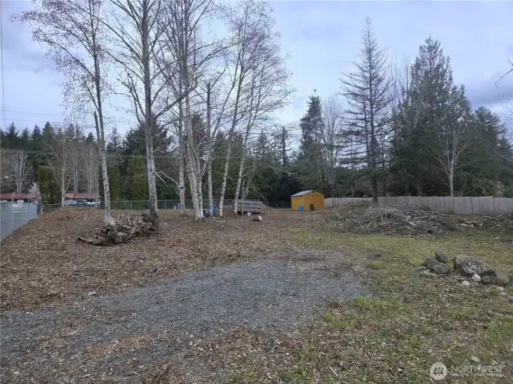 Inside the gate by the driveway facing north.