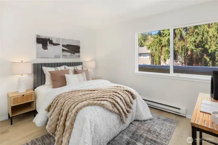 Main floor bedroom is bright and open.