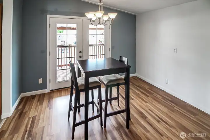 French doors open the dining room up to the covered porch!