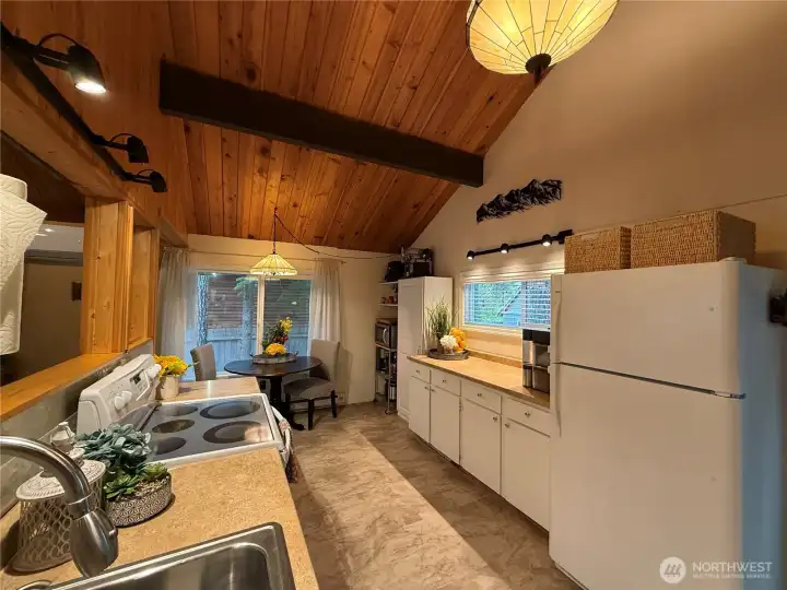 Spacious kitchen with luxury vinyl flooring.