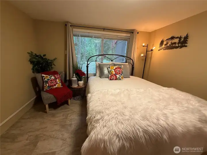 Downstairs spacious bedroom with luxury vinyl flooring.