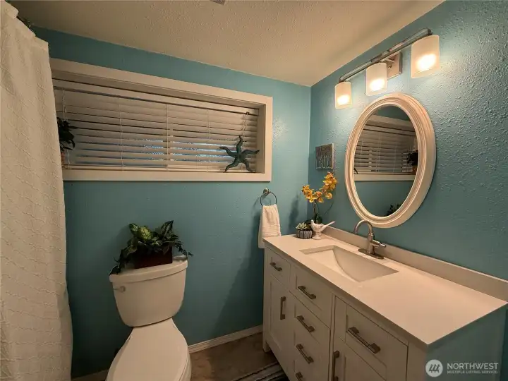 Full bathroom updated w/ soft close vanity drawers and outlets inside vanity.