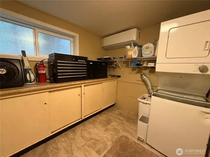 Utility room with washer and dryer and tons of extra storage.