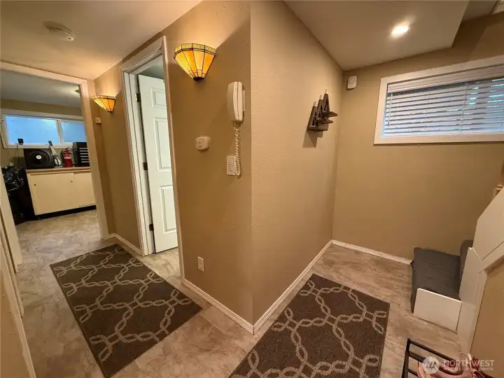 Downstairs entry with luxury vinyl tile throughout.