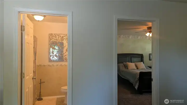 Upstairs into primary and full bathroom.