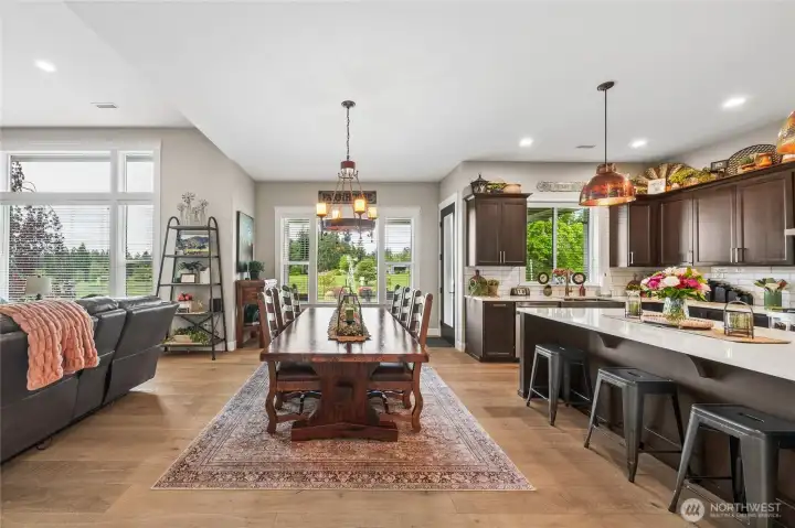 The entry hall opens into the spacious heart of the home, where the chef’s kitchen, dining area, and living room blend seamlessly together beneath high ceilings that enhance the home’s open, airy, and beautifully connected design. The entry hall opens into the spacious heart of the home, where the chef’s kitchen, dining area, and living room blend seamlessly together beneath high ceilings that enhance the home’s open, airy, and beautifully connected design.