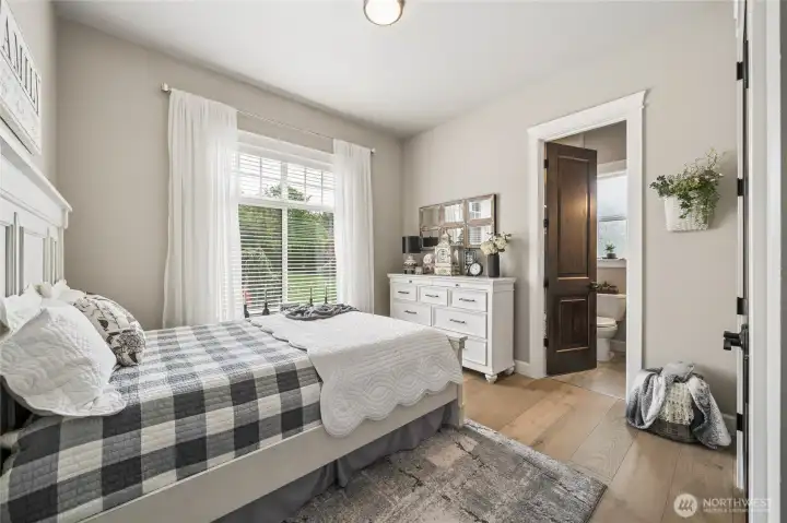One of the home’s beautifully appointed secondary bedrooms offers a bright and comfortable retreat with elevated ceilings and White Oak flooring. One of the home’s beautifully appointed secondary bedrooms offers a bright and comfortable retreat with elevated ceilings and White Oak flooring.