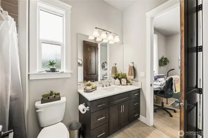 The beautiful Jack and Jill bathroom includes a marble vanity and a tub/shower with tile wall surround, offering a clean, cohesive design and convenient access from the adjoining bedrooms. The beautiful Jack and Jill bathroom includes a marble vanity and a tub/shower with tile wall surround, offering a clean, cohesive design and convenient access from the adjoining bedrooms.