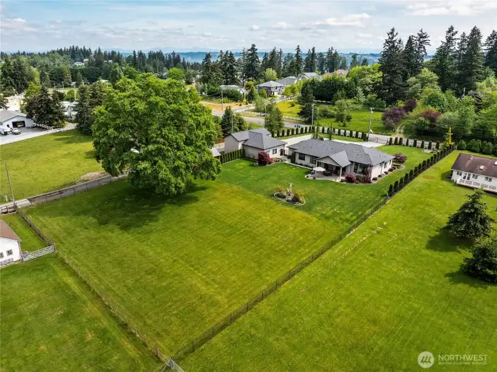 Aerial view of this stunning, meticulously manicured estate, highlighting the expansive grounds and beautifully maintained backyard that creates a striking sense of space, order, and privacy. Aerial view of this stunning, meticulously manicured estate, highlighting the expansive grounds and beautifully maintained backyard that creates a striking sense of space, order, and privacy.
