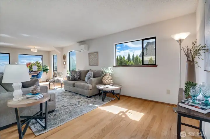 Natural light fills the living room, creating an inviting place to gather or unwind. Natural light fills the living room, creating an inviting place to gather or unwind.