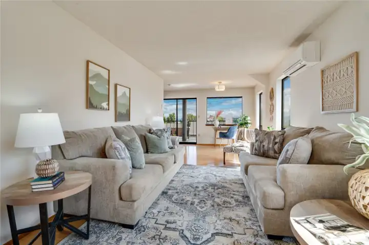 Large windows frame leafy neighborhood views and bring the outdoors in. Large windows frame leafy neighborhood views and bring the outdoors in.