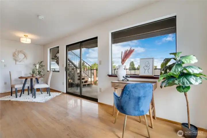The living room transitions naturally into the dining area, creating an easy flow for daily life and gatherings. A sliding glass doors offer easy access to the private balcony. The living room transitions naturally into the dining area, creating an easy flow for daily life and gatherings. A sliding glass doors offer easy access to the private balcony.