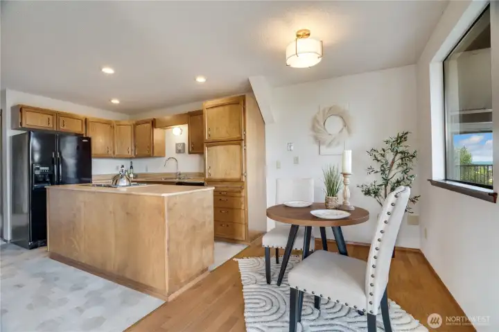 The dining area connects naturally with the kitchen while maintaining distinct spaces. Newer flooring in the kitchen makes moving in a breeze! The dining area connects naturally with the kitchen while maintaining distinct spaces. Newer flooring in the kitchen makes moving in a breeze!