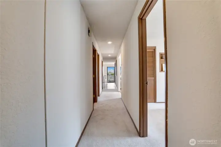 Tucked away down the hall from the main living spaces, the bedrooms and baths offer a sense of privacy and separation. Tucked away down the hall from the main living spaces, the bedrooms and baths offer a sense of privacy and separation.