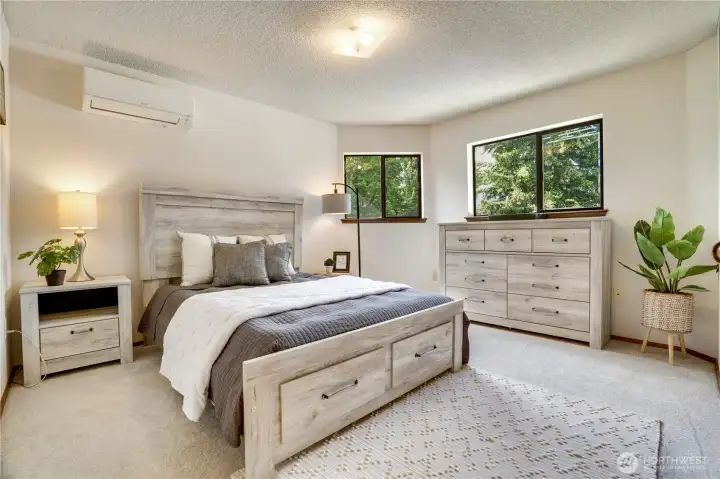 A peaceful primary retreat with ample closet space and its own ensuite bath, plus efficient heating and cooling with the ductless heat pump. A peaceful primary retreat with ample closet space and its own ensuite bath, plus efficient heating and cooling with the ductless heat pump.