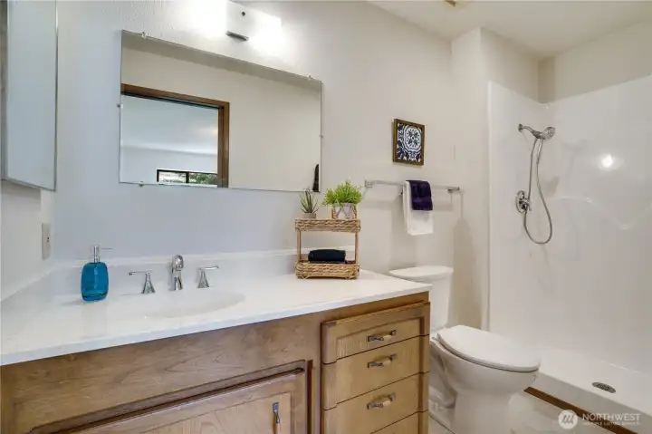 Convenient ensuite bath with a walk-in shower. Convenient ensuite bath with a walk-in shower.