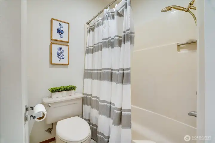 A full tub and shower combination offers flexibility for everyday living. A full tub and shower combination offers flexibility for everyday living.