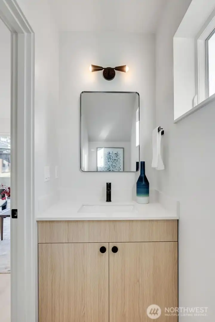 Convenient half bath on the main level. Convenient half bath on the main level.