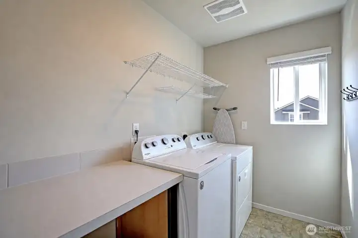 Laundry room with large folding table