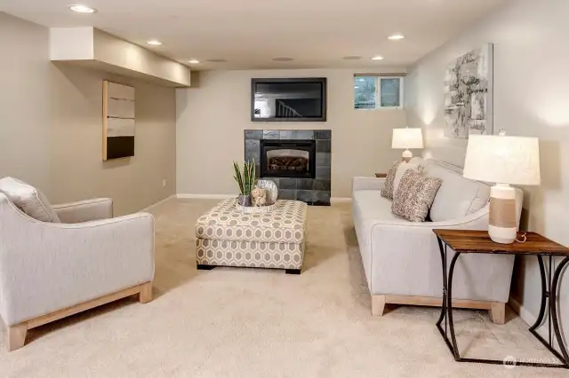 Lower level family room with gas fireplace.
