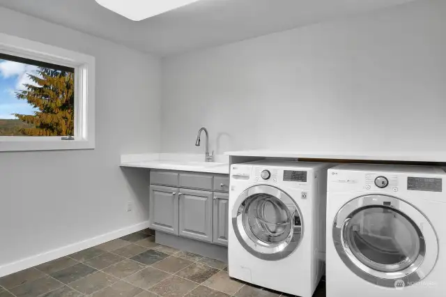 There is a big laundry room/ three-quarter bath on the main floor--LG washer and dryer are included.