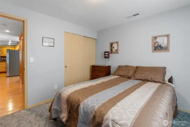 Another view of the first guest bedroom showing the double door closet.