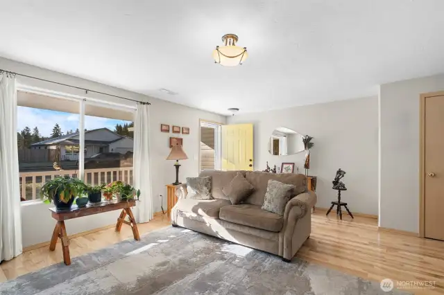 Large window allows for natural lighting to flood the front room.