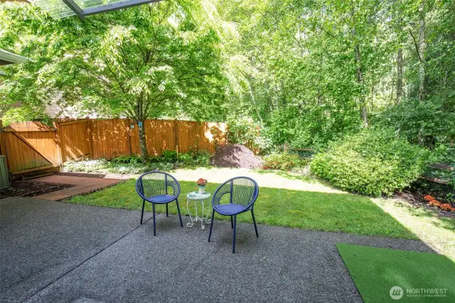 Park-like Backyard with Patio & Lush Landscaping.