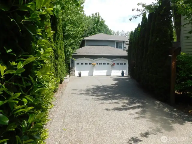 Long driveway to Entrance featuring 3 car garage!
