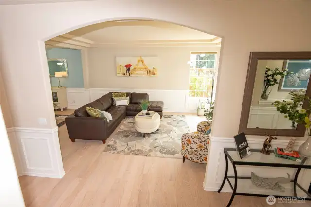 Entrance through Arched Opening to Living Room.