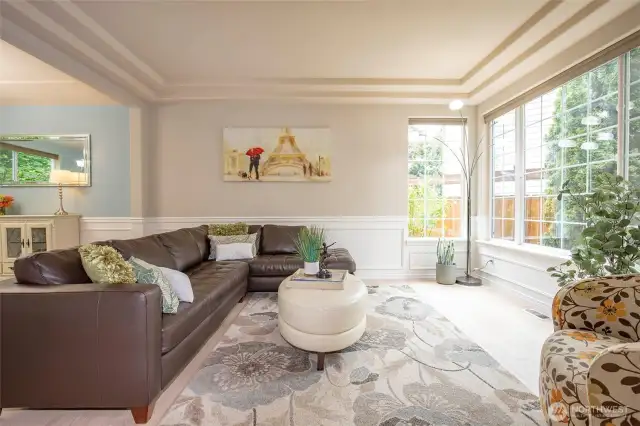 Living Room with Coffered Ceiling & Wall of Windows.