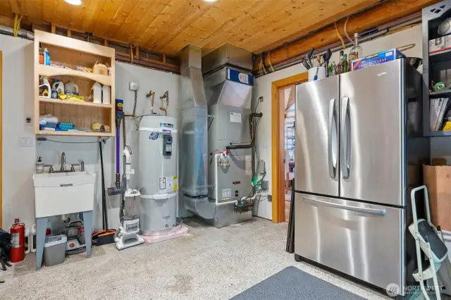 Tidy and well-equipped, the utility room houses modern mechanical systems and additional storage — easily accessible from the main living areas. Hot water tank & full HVAC system replaced in the last 3 years.