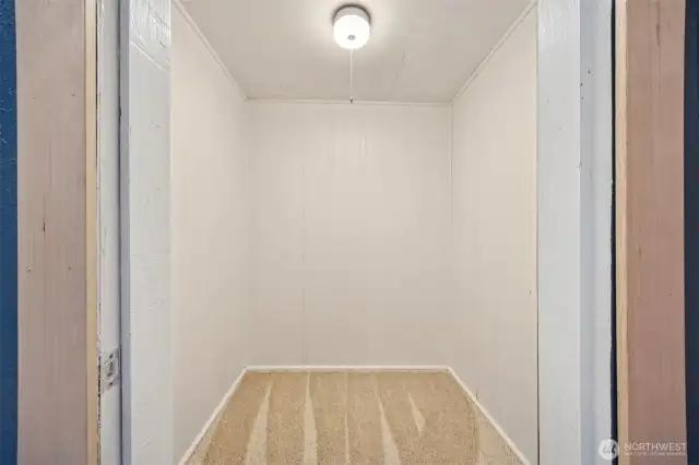 Primary bedroom walk in closet
